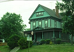 John and Anna O'Brien House in Stillwater, Minnesota, showcasing the prominent gable, pedimented porch and columns, all characteristic of the Queen Anne style