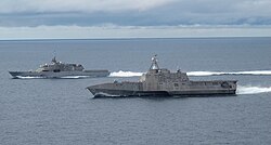The first ships of each class of littoral combat ships, USS Freedom and USS Independence, maneuver together during an exercise off the coast of Southern California, 2011