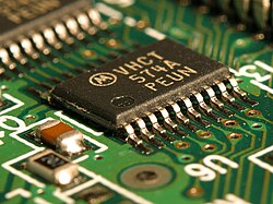 An integrated circuit (IC) on a printed circuit board. This is called a solid-state circuit because all of the electrical activity in the circuit occurs within solid materials.