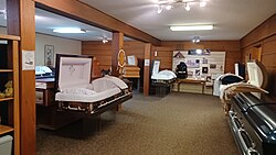 A casket showroom in Billings, Montana, depicting split lid coffins