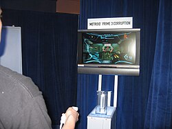 The Wii Remote being used to play Metroid Prime 3 at E3 2006. The Sensor Bar can be seen at the base of the television screen.