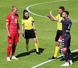 Fàbregas (furthest right, in black) playing for Monaco against Red Bull Salzburg in July 2021