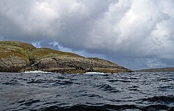 The headland of Rubha na Maighdein, Fuiay, on the left and the island of Flodaigh on the right