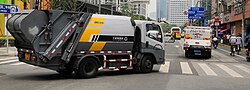 A residual waste truck and a kitchen waste truck in Huangpu