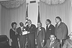 Lyndon Johnson meets with newspaper publishers in 1965.