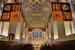 The King's Chapel of the Savoy, which acts as the chapel of the Royal Victorian Order (photographed in 2020). The banners are those of the Sovereign (right) and of the Grand Master (left) of the Order as they were then in office.