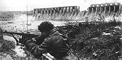 A Red Army soldier near the Dnieper hydro-electric dam