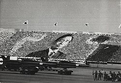 A card portrait of Park Chung Hee during a military parade on Armed Forces Day, 1 October 1973