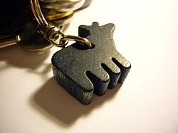 A wooden key fob made in Finland