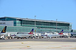 Cape Town International Airport's terminal building, with Airlink planes in front