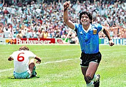 Diego Maradona, wearing Argentina's custom blue kit, celebrates his "Goal of the Century" against England in 1986