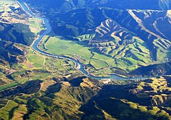 The Beaumont area, looking southwest. State Highway 8 runs across the photo (only visible in the right half), crossing the Clutha River just below centre.