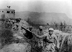 Victorious Chinese Communist soldiers holding the flag of the Republic of China during the Hundred Regiments Offensive