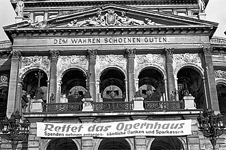 A banner reading "Save the Opera House". Arndt's plans to demolish the ruined Alte Oper were deeply controversial.
