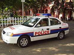 Greater Chennai Police officers patrolling in a police car in Chennai, India