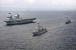 HMS Queen Elizabeth, a Queen Elizabeth-class supercarrier on sea trials in June 2017