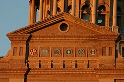 Six coats of arms displayed under the Texas State Capitol Dome (from left to right: Spanish, French, Mexican, Republic of Texas, Confederate States, and United States)