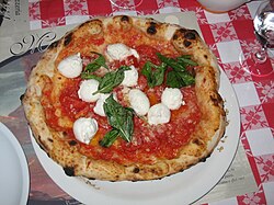 The ingredients of pizza Margherita—tomatoes (red), mozzarella (white), and basil (green)—are said to be inspired by the Italian flag.[48]