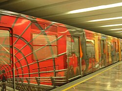 Mexico City Metro train in Bellas Artes station, decorated with images related to the city