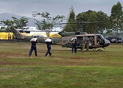 An Australian Army UH-1 Iroquois helicopter on the island of Sumatra, Indonesia after the 2004 Indian Ocean earthquake and tsunami.