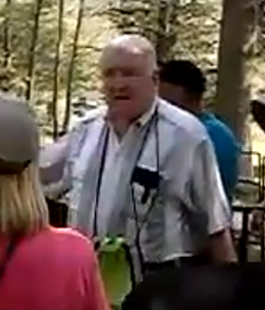 Edward J. Lenik speaking at a trail.