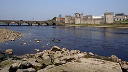 The River Shannon runs through Limerick City, with King John's Castle.
