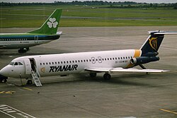 Two of the airport's largest operators side-by-side, a Ryanair BAC 1-11 (front) in its oldest livery, and an Aer Lingus Boeing 737 (rear) in 1993