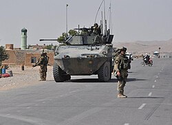 Sassari Mechanized Brigade soldiers on patrol with a VBM Freccia in Afghanistan