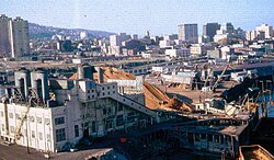 1966 photo shows sawdust-fired power plant on the edge of downtown that was removed to make way for dense residential development. High-rises to left in background were early projects of the Portland Development Commission.