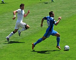 Bale (left) chasing San Jose Earthquakes player Arturo Alvarez in a pre-season friendly in July 2010