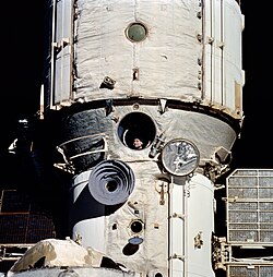 Cosmonaut Valeri Polyakov looks out space station Mir's window during his 438-day flight in 1994–1995