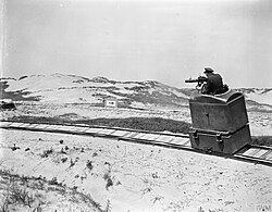 The RAF Gunnery School between Rang-du-Fliers and Verton. A pilot officer firing at fixed targets representing German aircraft from a 'cockpit' moving along curving rails. 17 July 1918