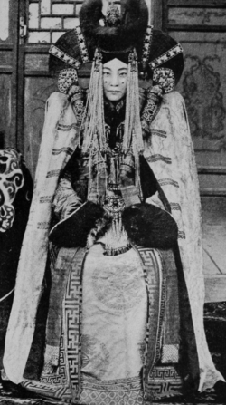 A Mongol woman seated for a portrait, 1921