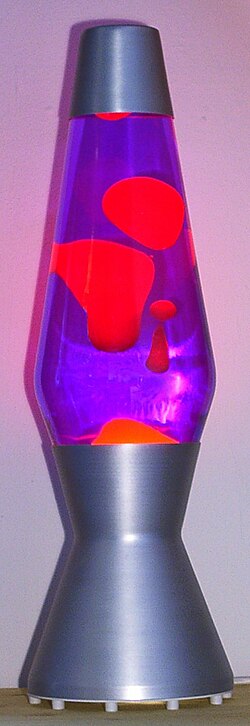 A lava lamp is a novelty item that contains wax melted from below by a bulb. The wax rises and falls in decorative, molten blobs.