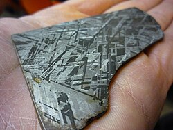 Widmanstätten pattern showing the two forms of nickel–iron, kamacite and taenite, in an octahedrite meteorite