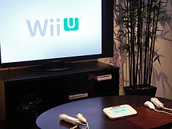 A display of the console and GamePad (referred to as the "New Controller" at the time) at E3 2011
