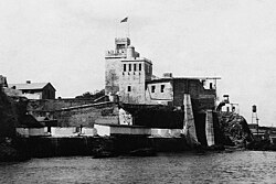 The flag of the United States waving over Ozama Fortress during the U.S. occupation of the Dominican Republic, c. 1922