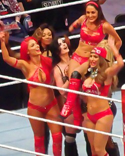 Eva Marie (far left) celebrating with her fellow Total Divas co-stars, their victory at WrestleMania 32 in April 2016