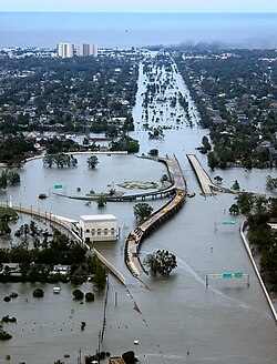 The draining and development of coastal wetlands that previously protected the Gulf Coast contributed to severe flooding in New Orleans, Louisiana, in the aftermath of Hurricane Katrina in 2005.[52]