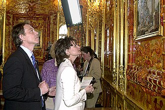 Blair with his wife, Cherie Booth, touring the recreated Amber Room during a visit to the Catherine Palace in Russia, 2003