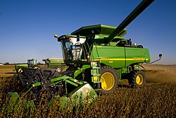 A John Deere combine harvester on an Illinois farm; the company is headquartered in Moline, Illinois.