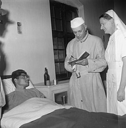 Nehru visiting an Indian soldier recovering from injuries at the Brigade Headquarters Military Hospital in Srinagar, Kashmir