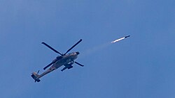 Israeli Air Force AH-64 Apache helicopter gunship launches an AGM-114 Hellfire missile at a "terror cell" of rocket launchers in action