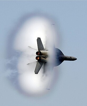 A United States Navy F/A-18F Super Hornet in transonic flight