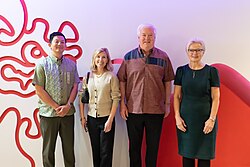 George and Mary Glass (center) during a visit to the Okinawa Institute of Science and Technology