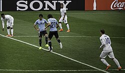 Rooney (number 10) playing for England against Uruguay at the 2014 FIFA World Cup