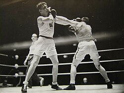 Boxer (left) using cross block
