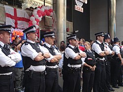 Metropolitan Police officers on crowd control to prevent football hooliganism after England lost to Portugal, 1 July 2006