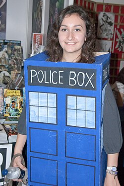 The image of the TARDIS is iconic in British popular culture. Here, a woman is dressed as a TARDIS.