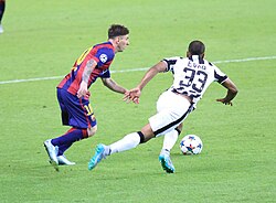 Messi challenging Patrice Evra in the Champions League Final